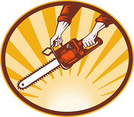 Image showing hand holding chainsaw 