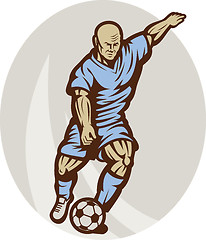 Image showing Soccer player kicking the ball