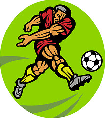 Image showing Soccer player kicking the ball