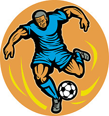 Image showing Soccer player kicking the ball