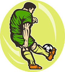 Image showing Soccer player kicking the ball