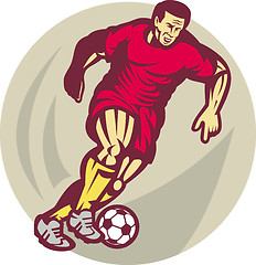 Image showing Soccer player kicking the ball