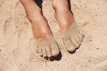 Image showing Feet in sand