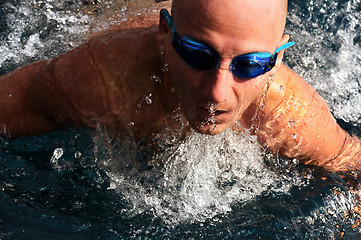Image showing Detail of young man swimming