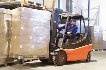 Image showing forklift at work with driver