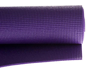 Image showing purple yoga mat on white