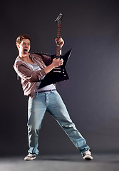 Image showing passionate guitarist playing