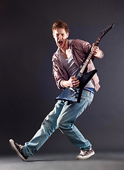 Image showing passionate guitarist
