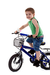 Image showing  boy riding a  bike 