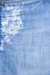 Image showing detail of torn blue denim