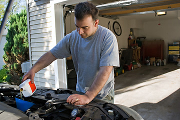Image showing Man Changing the Oil