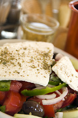 Image showing greek salad with house wine