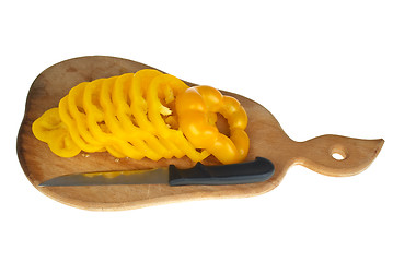 Image showing Cutting board with sliced yellow bell pepper and small knife