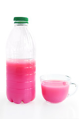 Image showing Bottle and a cup with a pink drink