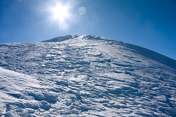 Image showing Winter mountains landscape against the sun