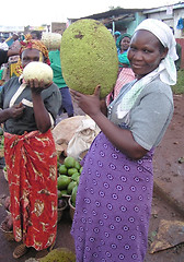 Image showing market vendor and breadfruit