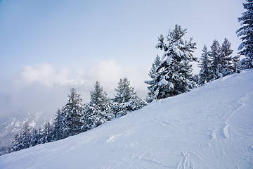 Image showing Ski slope and winter mountains panorama