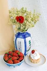 Image showing Strawberries, cake and a vase with flowers