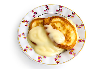 Image showing Two pancakes with condensed milk