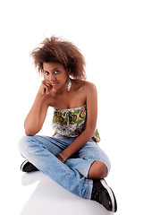 Image showing beautiful black  woman, sitting on the floor