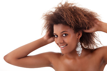 Image showing beautiful black woman, holding her hair with his hands