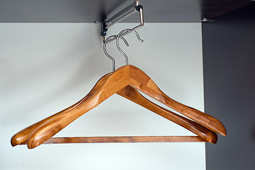 Image showing Hangers in closet