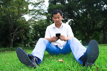 Image showing man using cellphone