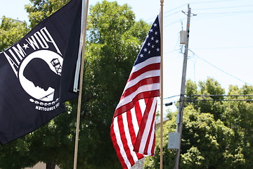 Image showing American And POW Flags