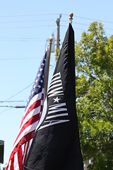 Image showing American And POW Flags