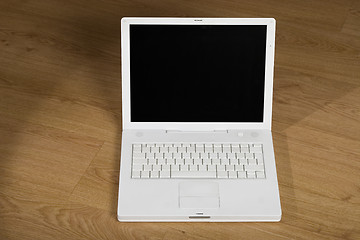 Image showing white notebook on wooden background