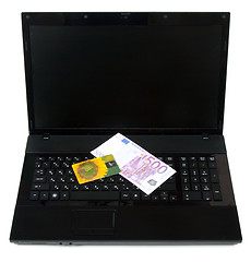 Image showing Yellow bank card rests upon keyboard