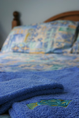 Image showing Towels folded on bed