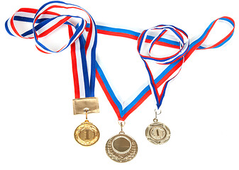 Image showing Three medals for first place with tape