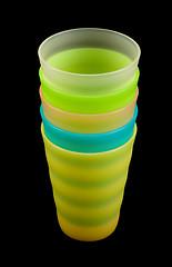 Image showing Colour plastic glasses by pile