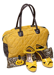 Image showing Feminine bag and pair yellow feminine loafers