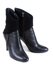 Image showing Black feminine leather boots with suede insertion