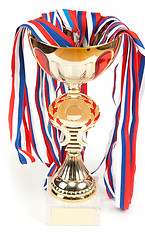 Image showing Golden cup, medals with tape