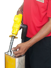 Image showing Man filling a gasoline container