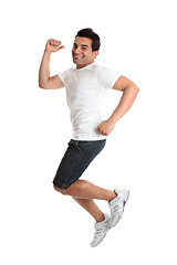 Image showing Excited energetic jumping man success