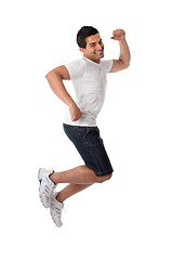 Image showing Thrilled man jumping for joy
