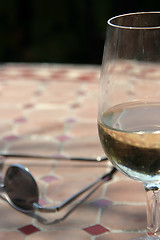 Image showing Half full glass of white wine