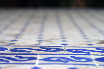 Image showing Detail of tiled table top