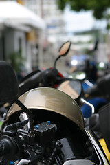 Image showing Motorcycle helmet placed on motorbike