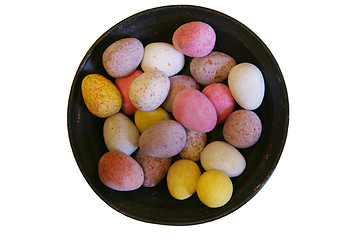 Image showing Mini candy chocolate eggs in a round dish (isolated)