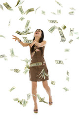 Image showing pretty woman throwing money