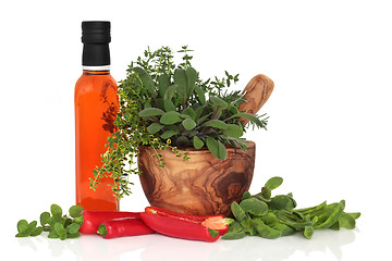 Image showing  Chillies, Oil and Herb Leaves