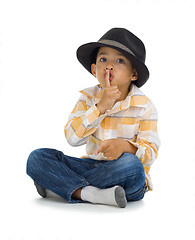 Image showing cute boy with finger on his lips