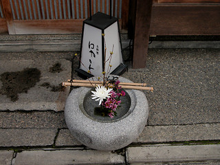 Image showing Lantern and flowers