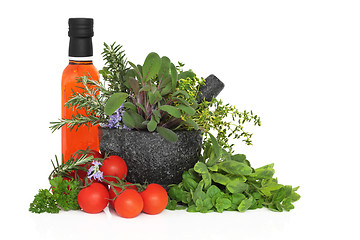 Image showing Chili Oil, Herb Leaves and Tomatoes
