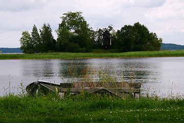 Image showing Small island with windmill